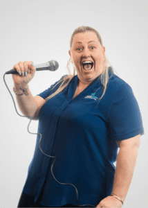 Katie Parkinson Business Support Officer singing