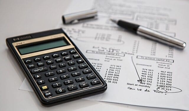 Bookkeeping Calculator and pen on a bank statement