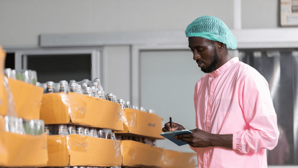 Man in warehouse counting import stock