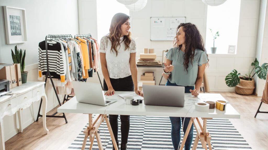 two women working on their small business in a studio