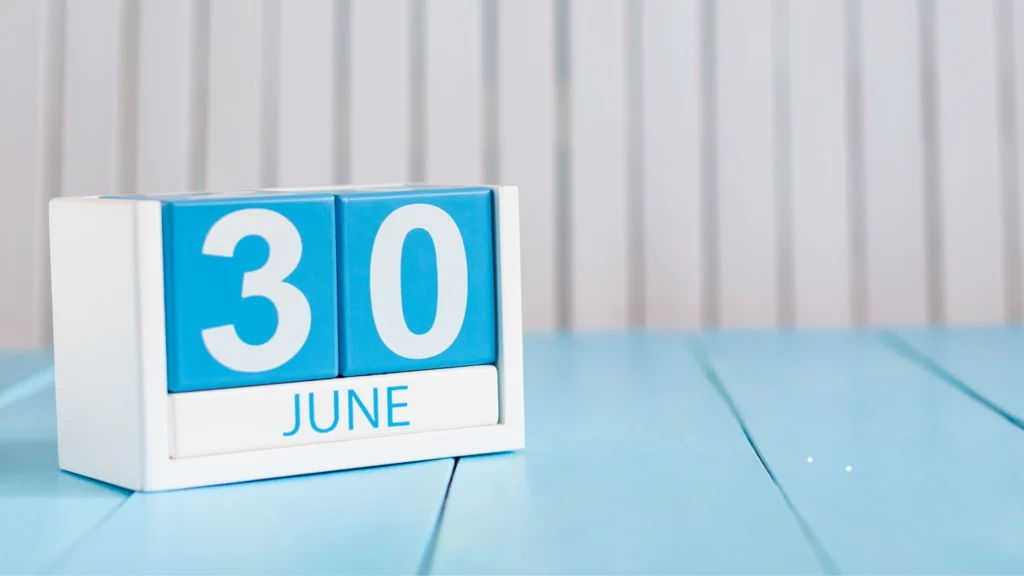 wooden block calendar June 30 indicating Tax Return and EOFY