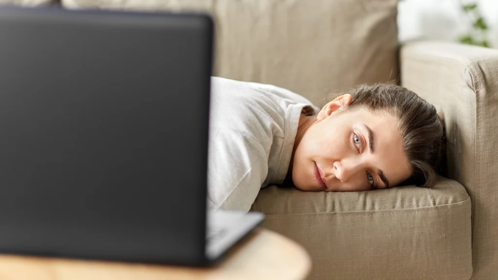 Person lying on couch