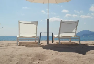 Two beach chairs overlooking the ocean symbolising the Christmas Summer holidays in Australia